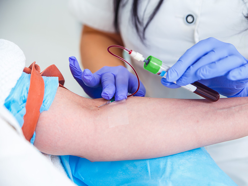 Licensed nurse collecting blood sample for lab test at home in Dubai